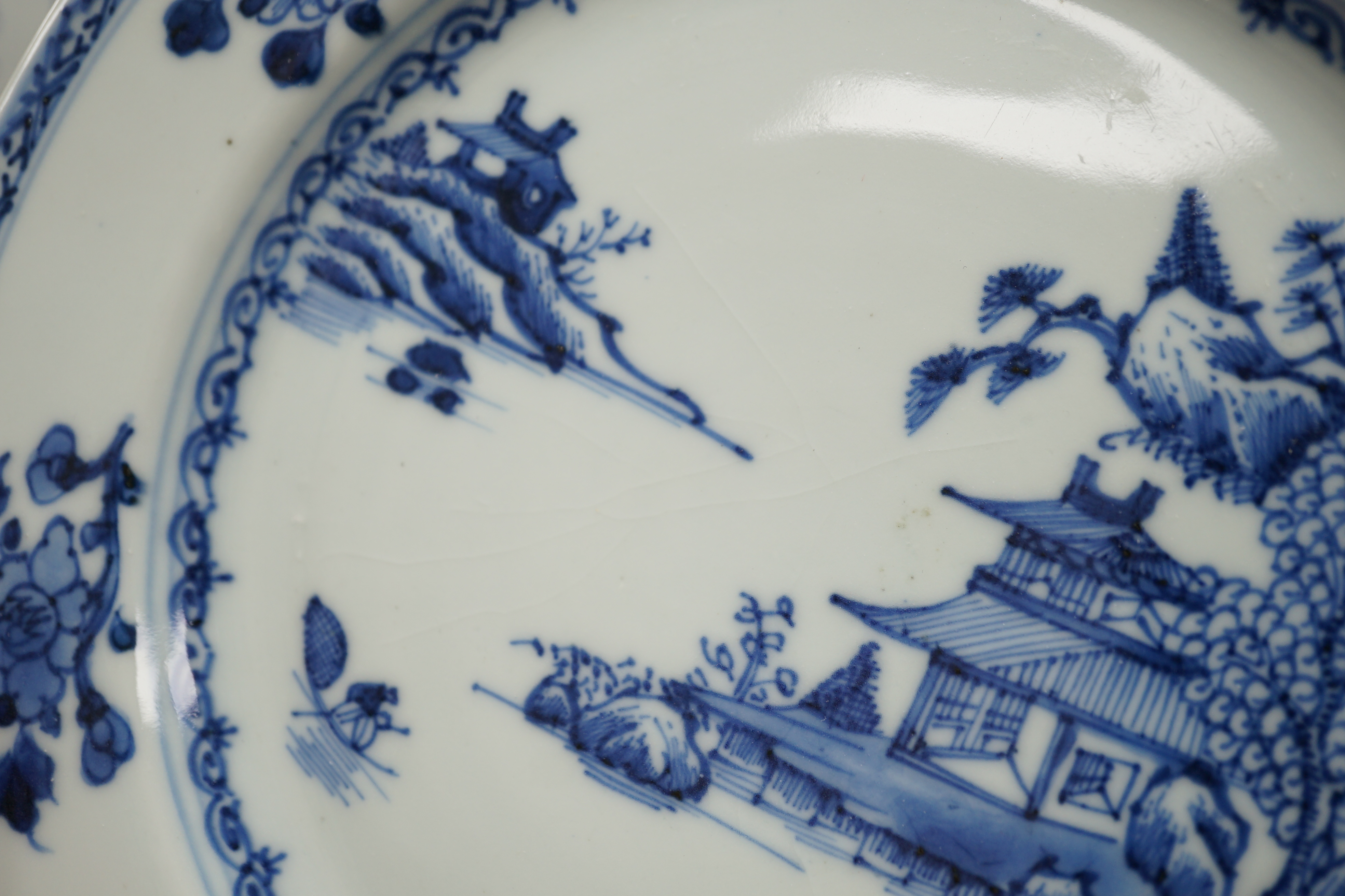 A set of twelve Chinese Nanking Cargo ‘Boatman’ blue and white plates, Qianlong period